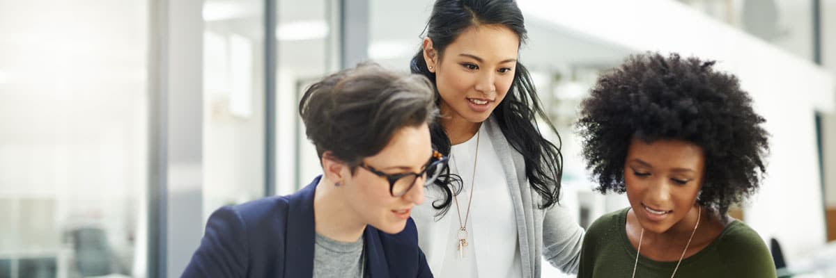 Women Working Together on Project in Office
