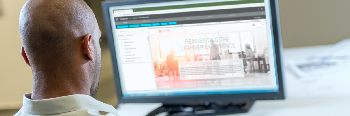 Back view of Man Looking at Out of Focus Computer Screen