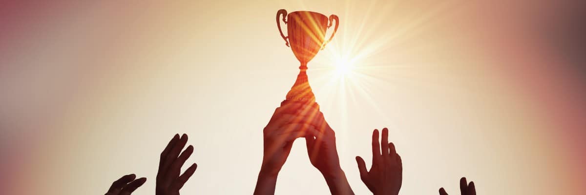 Pair of Hands Holding Up Trophy