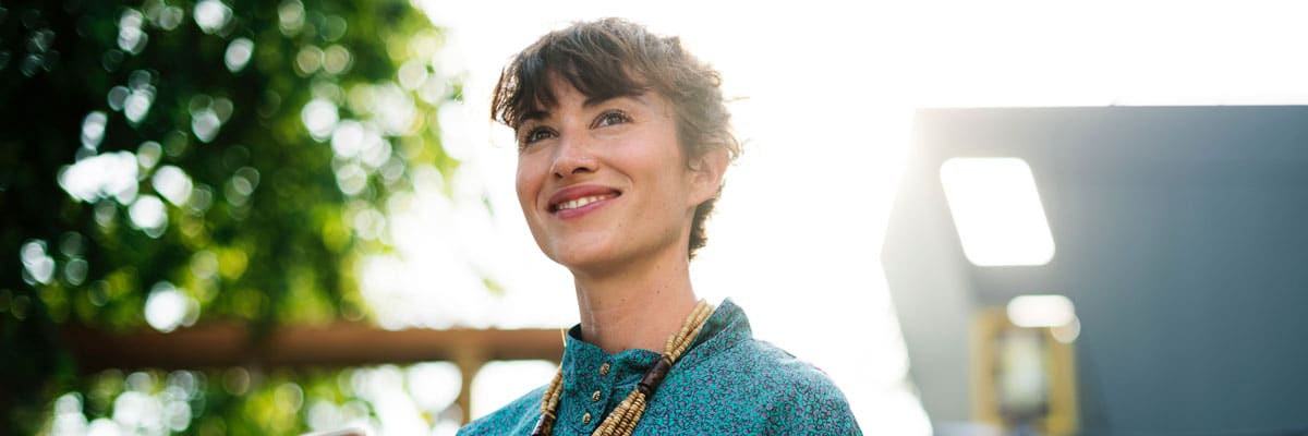 Woman Smiling off While Looking in the Distance