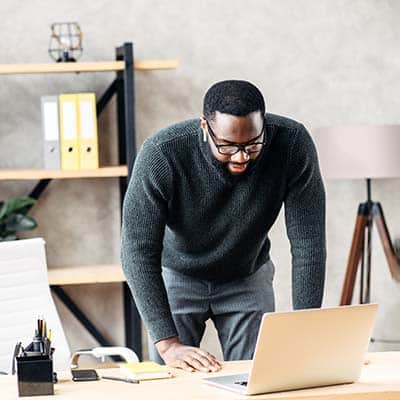 Man using a laptop to complete upskill and reskill training