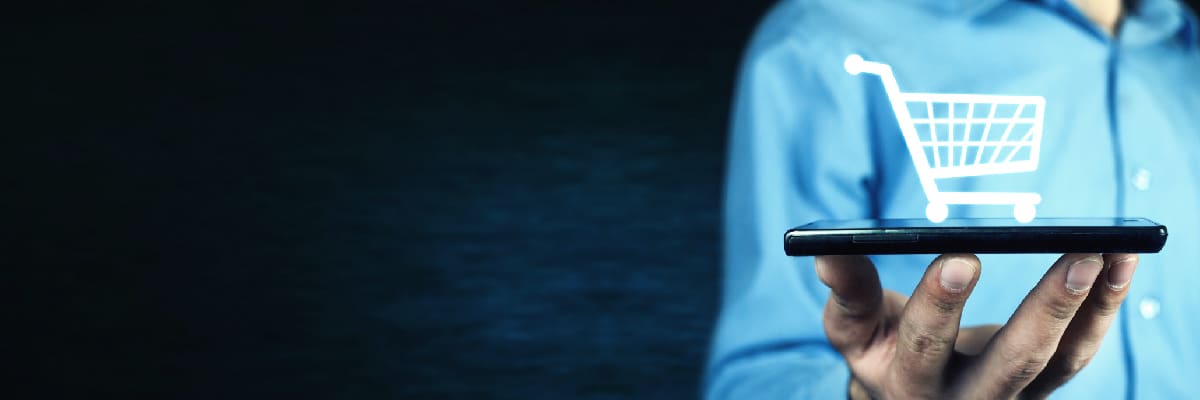 Hand Holding Up Phone with Shopping Cart Icon