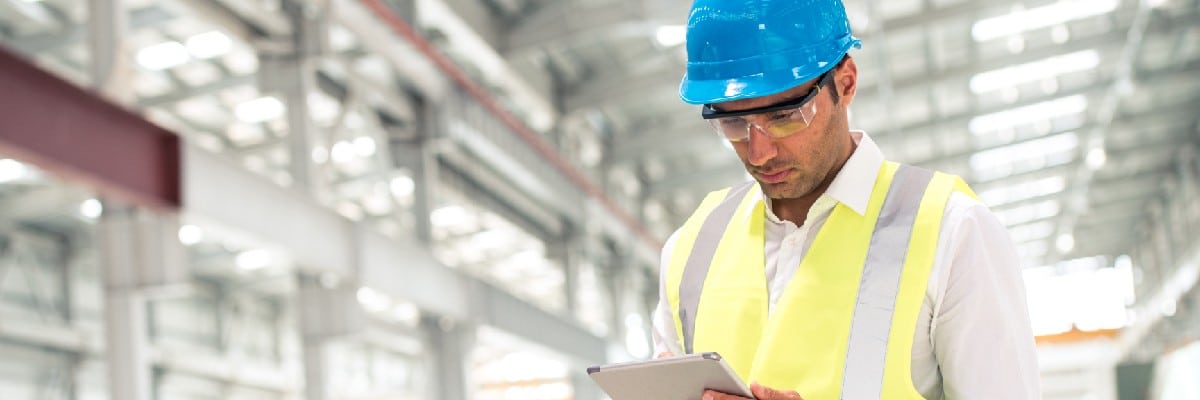 Man in Hard Hat Using a Tablet