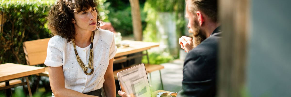 Woman Listening to Man Intently Outside