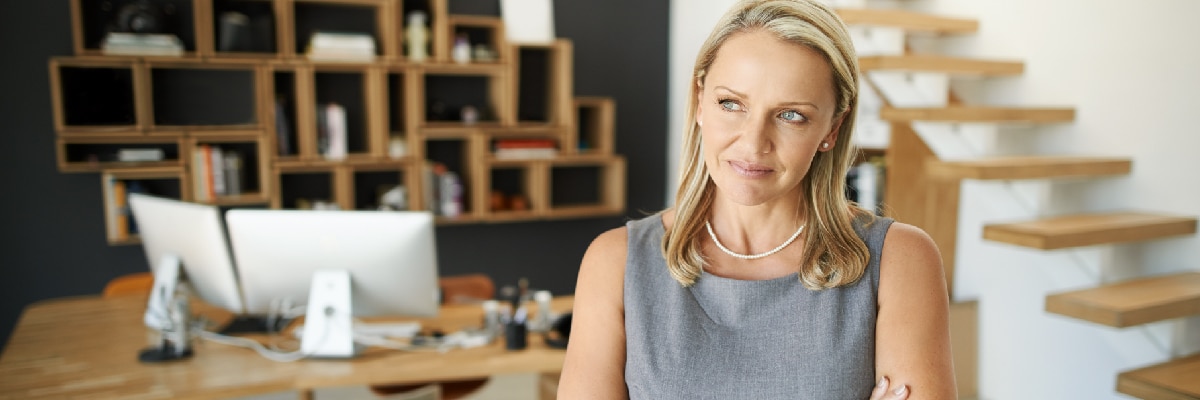 Business Woman With Arms Folded Thinking