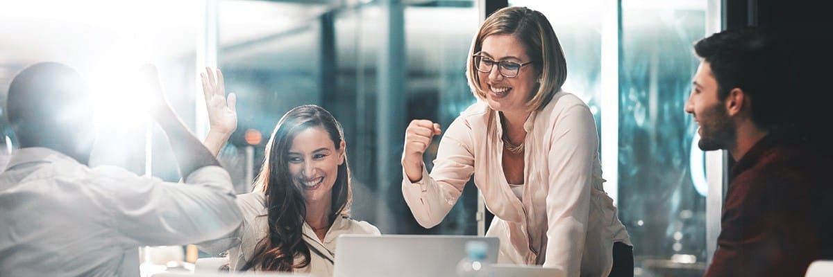 Group of Colleagues Cheering for a Job Well Done