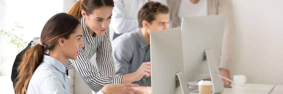Two Women Discussing a Project on the Computer