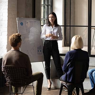 Team of people determining training metrics in a meeting