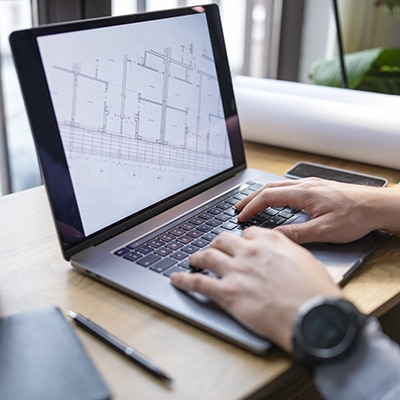 Person working on training metrics on their computer