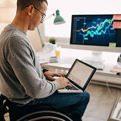 Consultant establishing training metrics on a computer