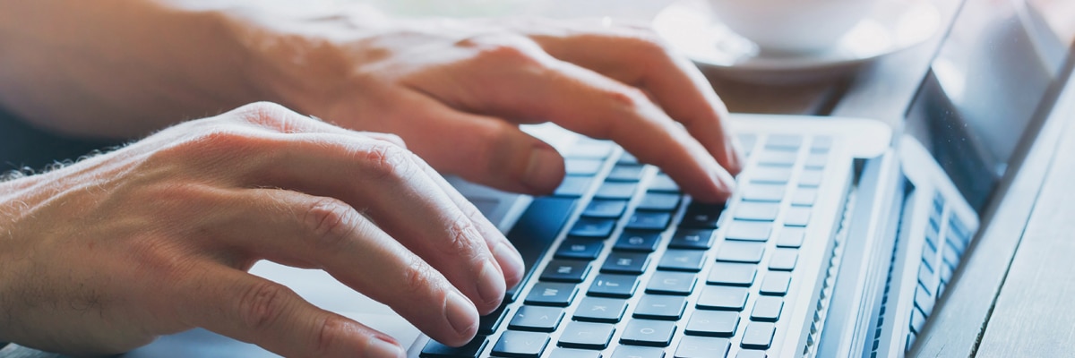 Hands Typing on a Computer