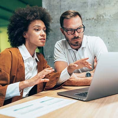 Woman from a training consulting company discussing with a man