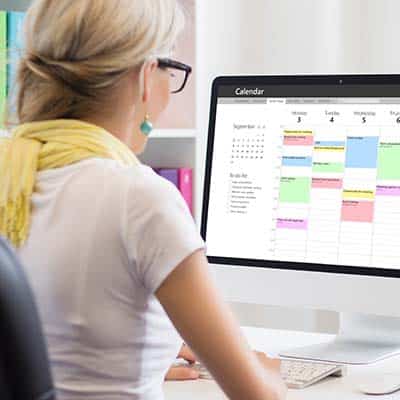 Woman scheduling training for employees