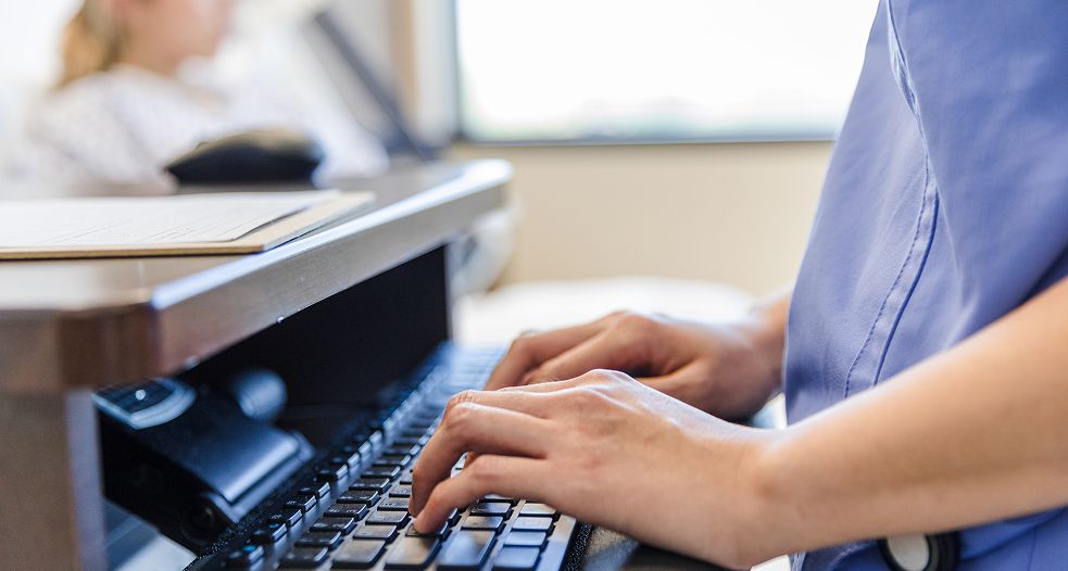 A person typing on a keyboard