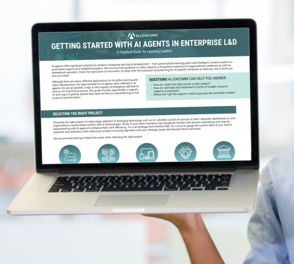 A person holding a laptop showing the words "Getting Started with AI Agents in Enterprise L&D."