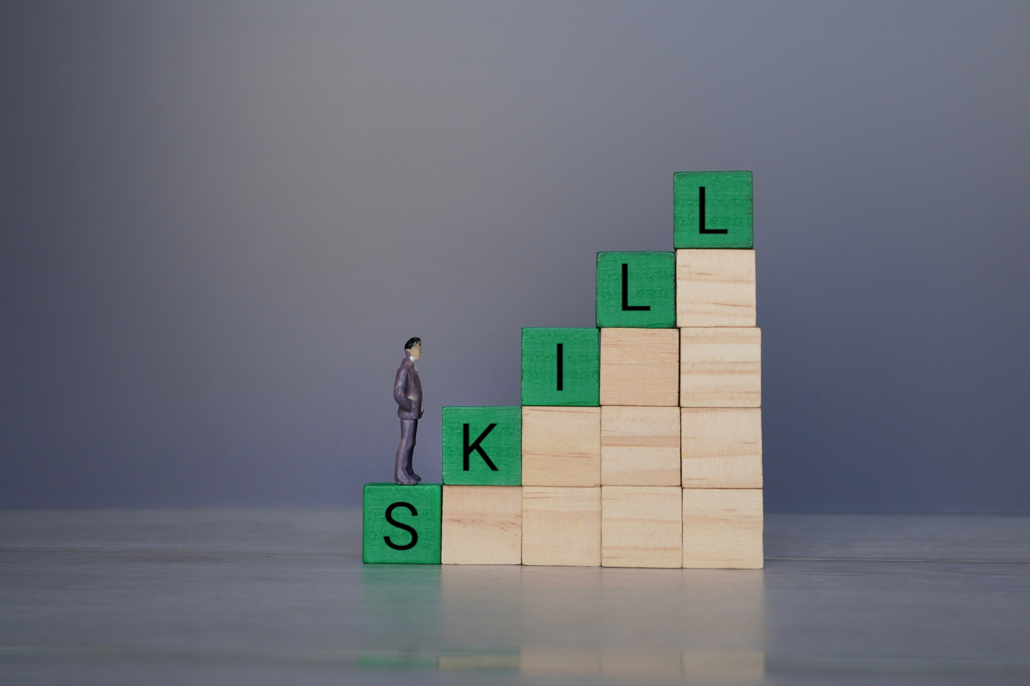 Upskilling vs reskilling comparison showing employees learning new skills and transitioning roles through targeted training.